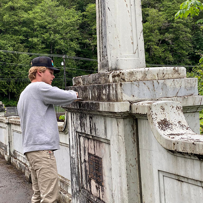 young man cleaning bridge