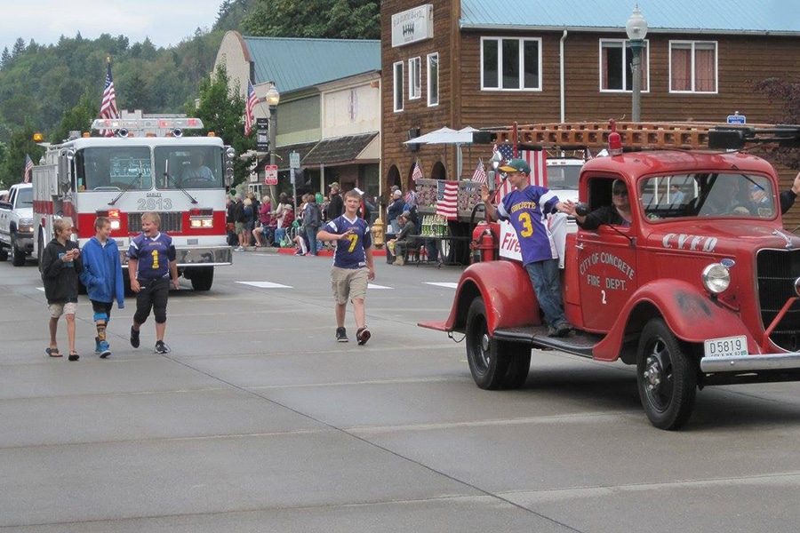old and new firetruck in parade